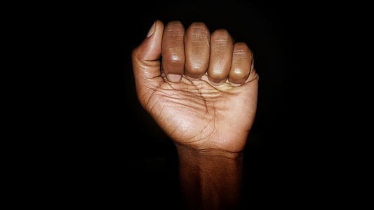 human fist with black background