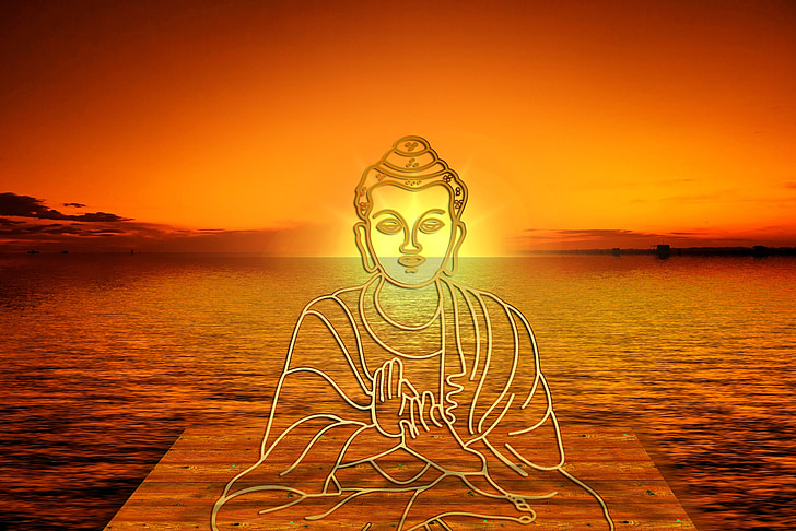 Gautama Buddha on dock fronting sunset