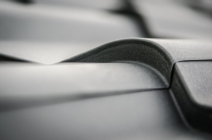 closeup photo of gray corrugated galvanized sheet