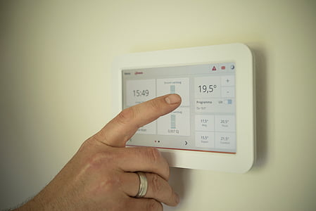 white thermostat reading at 19.5