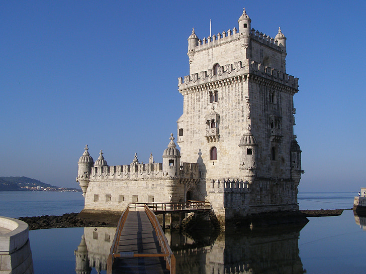 concrete castle surrounded with body of water