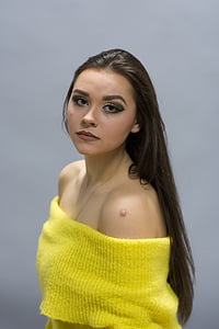 selective focus photography of yellow knit off-shoulder top