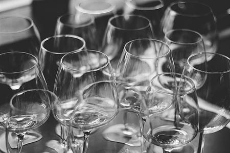 grayscale photo of clear wine glasses