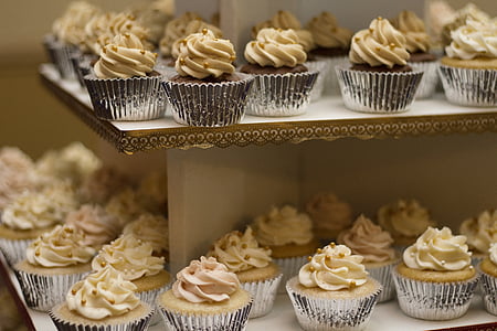 cupcakes on white wooden shelf