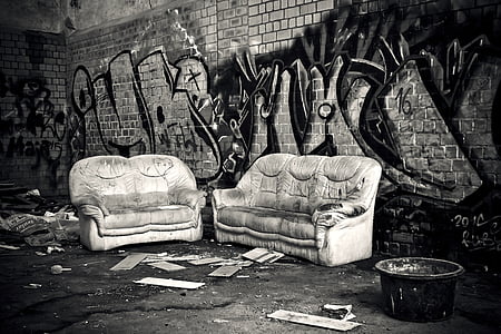 two empty gray sofas