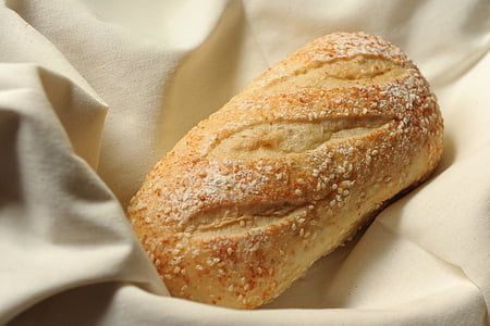 selective focus photography of bread with sesame seeds