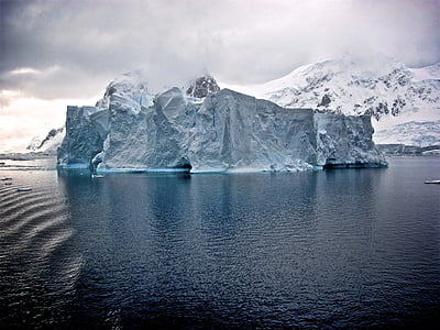 iceberg in the middle of body of water