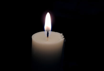 lighted white candle