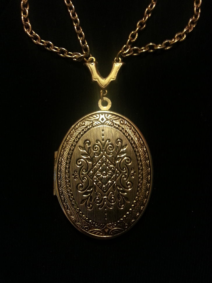 oval gold-colored locket