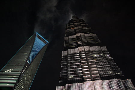 worm's eyeview photography of gray building during nighttime