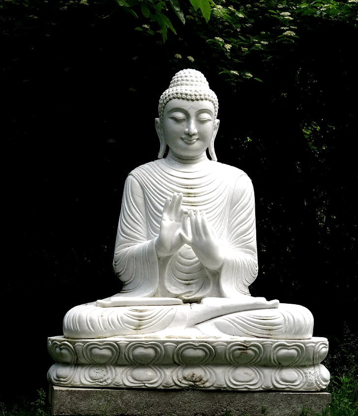 white ceramic buddha figurine