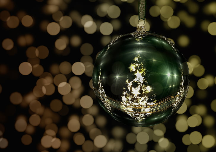 green and gold bauble with bokeh background