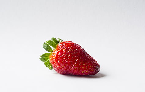 strawberry on white surface
