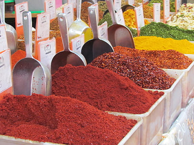 assorted spices on white plastic bins