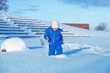 toddler walking on snowfield
