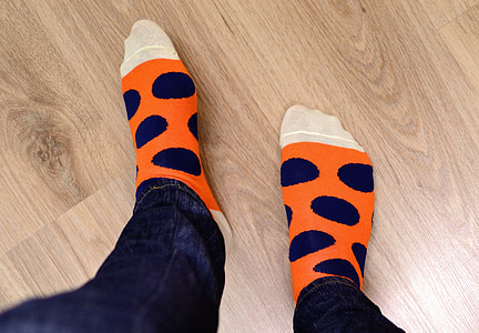 person in orange and blue socks