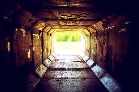 brown tunnel leading outside
