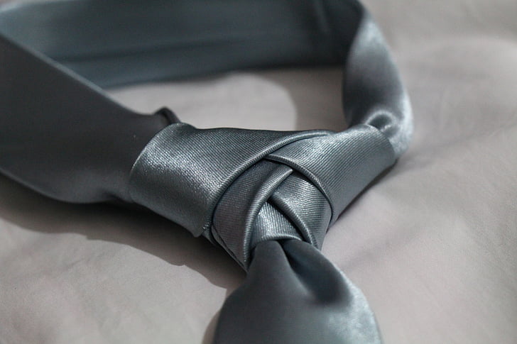 gray necktie on white textile