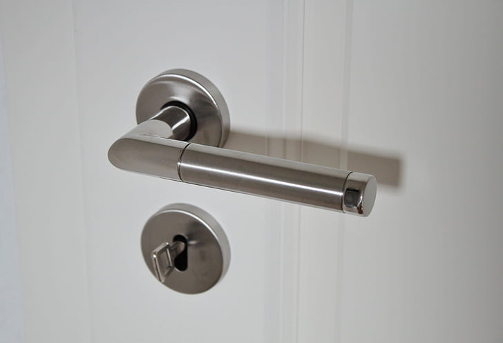 silver door handle and deadbolt with key