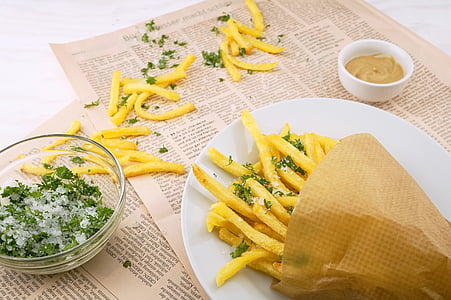 plate of French fries with dipping sauce