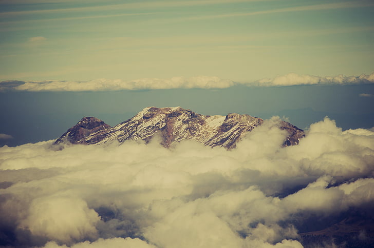 aerial photography of snow mountain surrounded by clouds