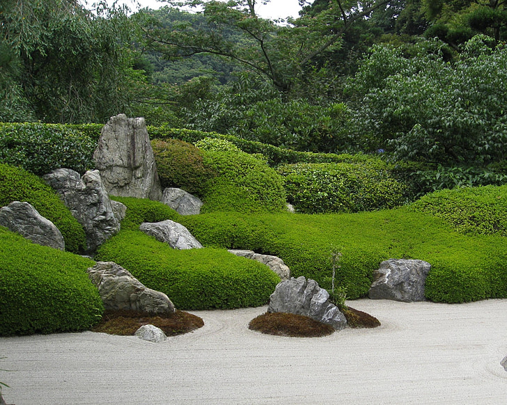 green grasses and rock formations