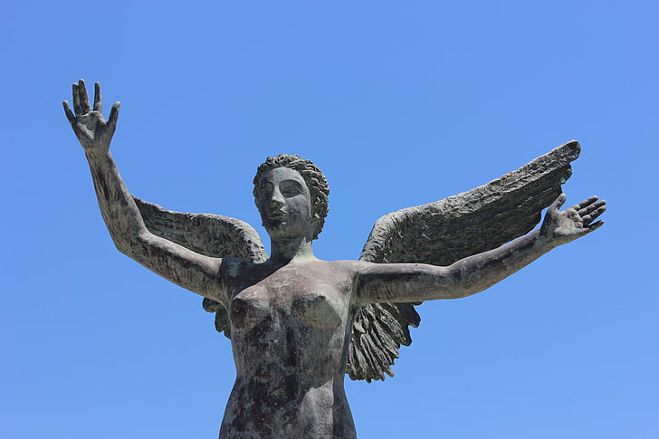 closeup photo of female angel statue