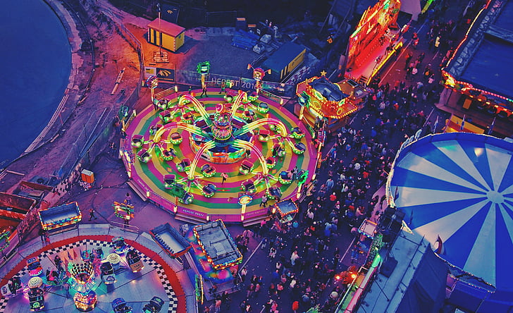 people at amusement park during night time