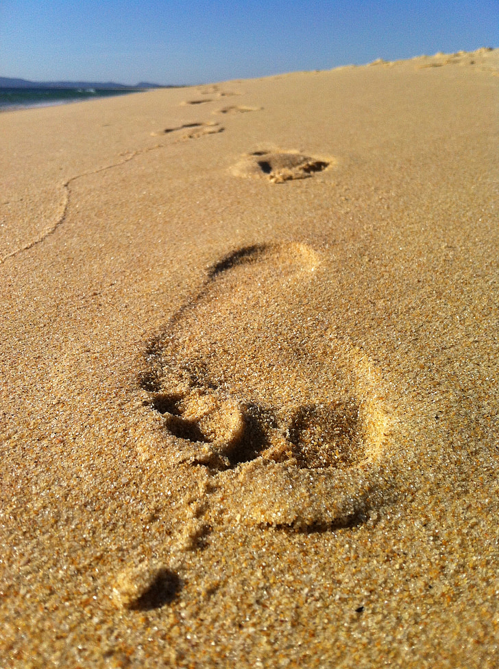 close-up photo of footprint on sand