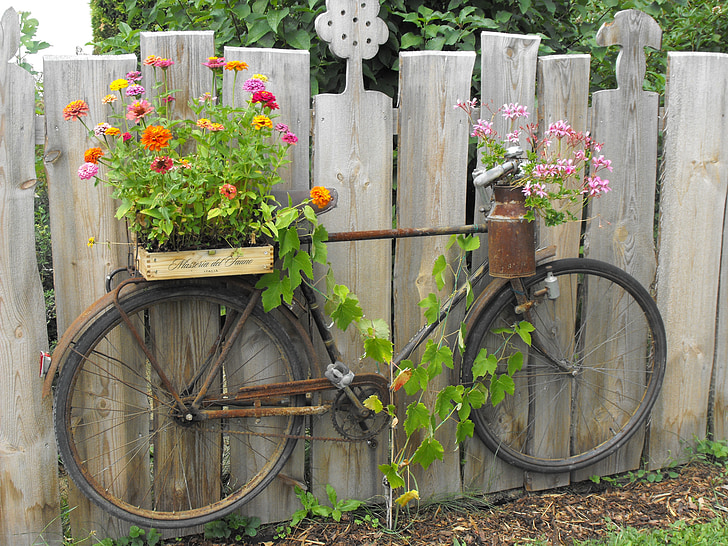 two flower pots on brown bike pot rack
