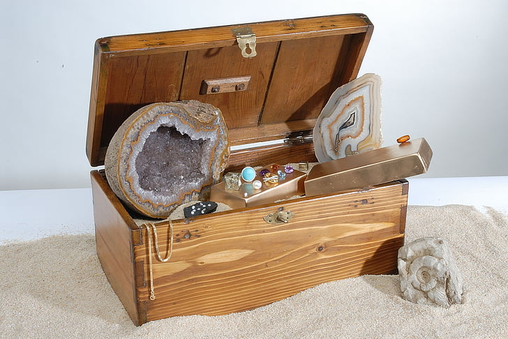 brown and gray geode stone inside brown wooden chest box