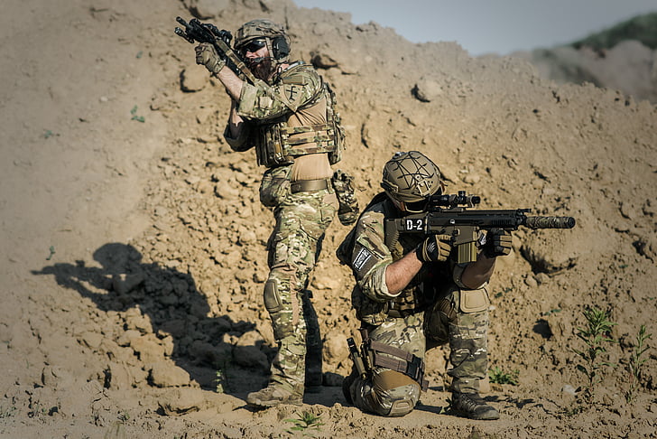 two army holding rifles