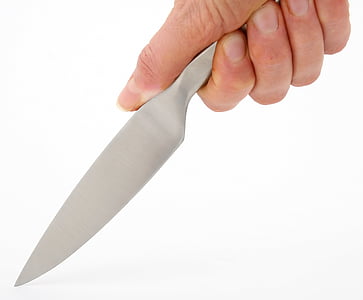 person holding gray knife