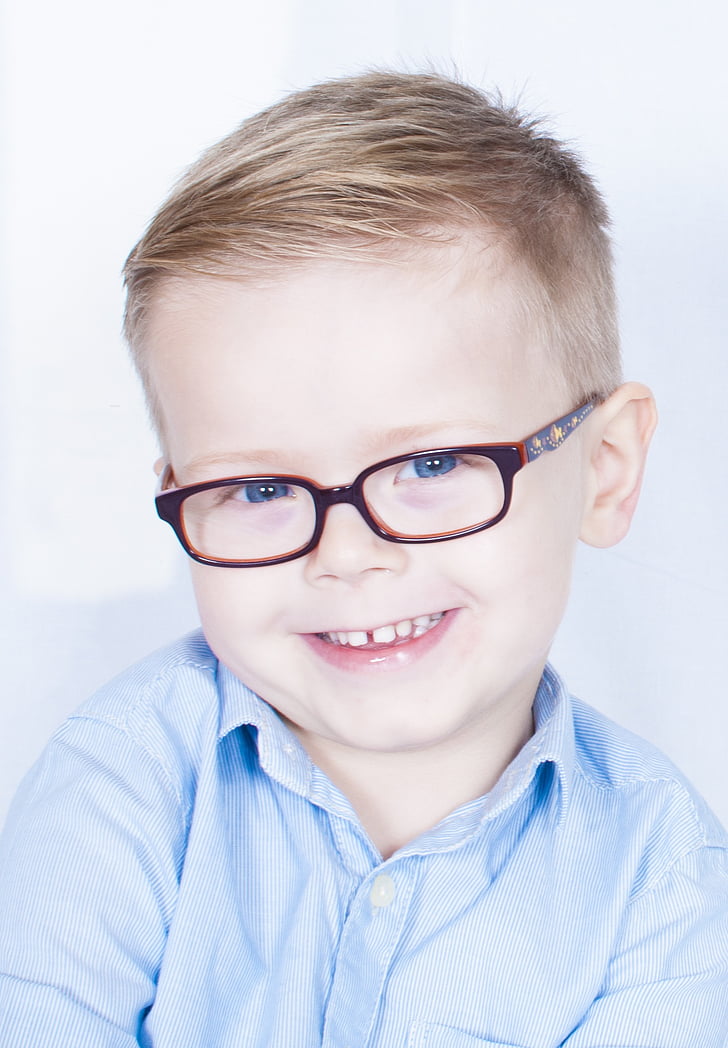 boy wearing eyeglasses with red frames