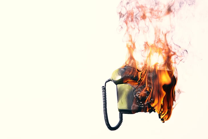 gray telephone burning digital wallpaper