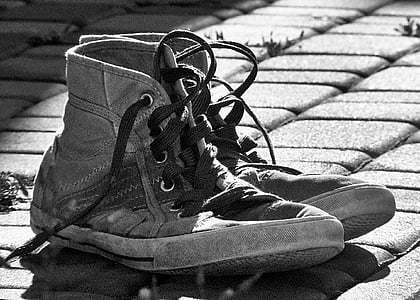 grayscale photography of high-top sneakers