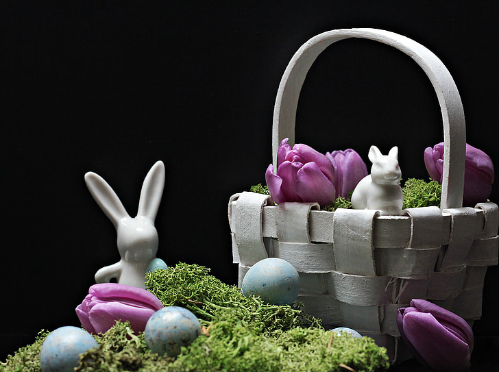 white rabbit ceramic figurine beside woven basket