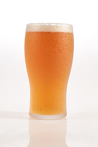 beer filled clear highball glass