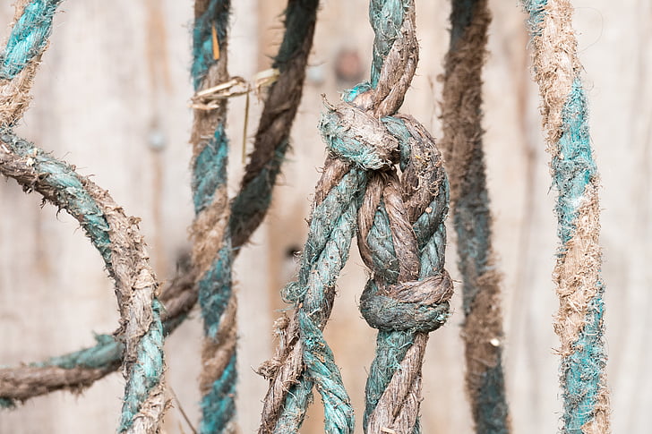 close up photo of teal and brown rope