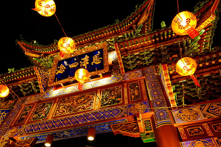 chinese temple gate with lighted lanterns