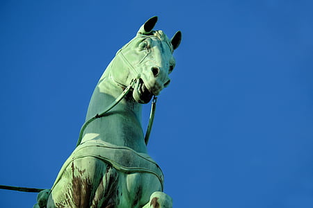 close-up photography of green horse statue