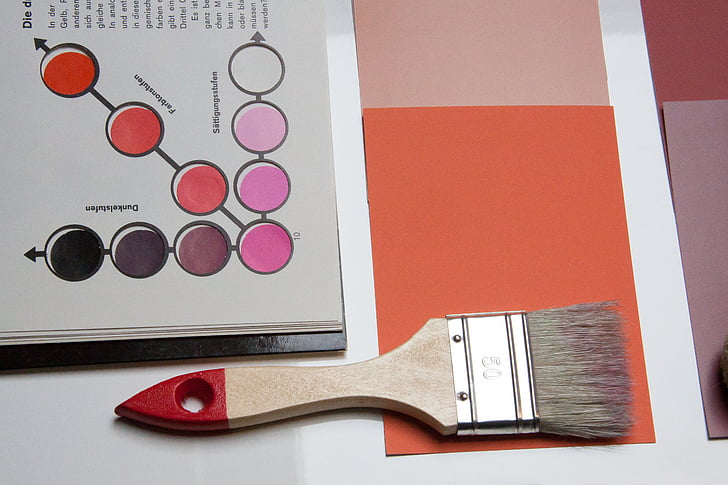 brown and red handled paint brush