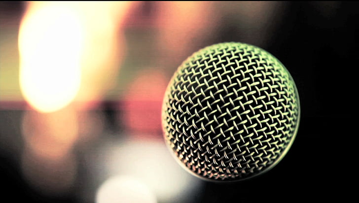 selective focus photography of condenser microphone with bokeh background