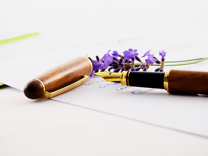 brown fountain pen on white paper sheet