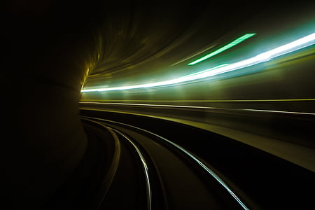 timelapse photography of railtrack inside tunnel