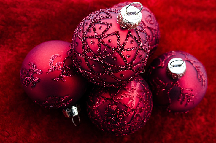 close shot of five red ornaments