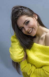 woman wearing yellow off-shoulder sweater