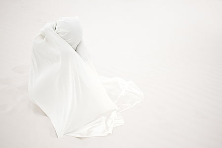 person covered with white textile
