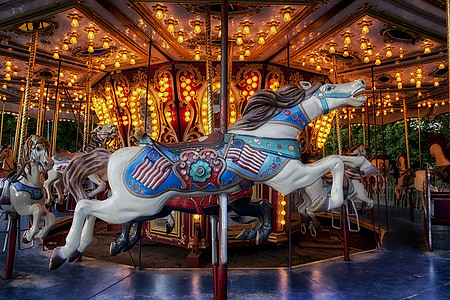 gray and white horse carousel at daytime