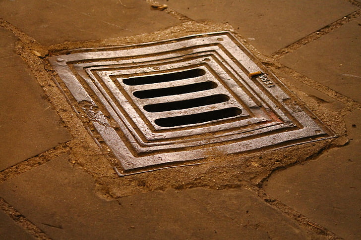 closeup photo of gray drainage
